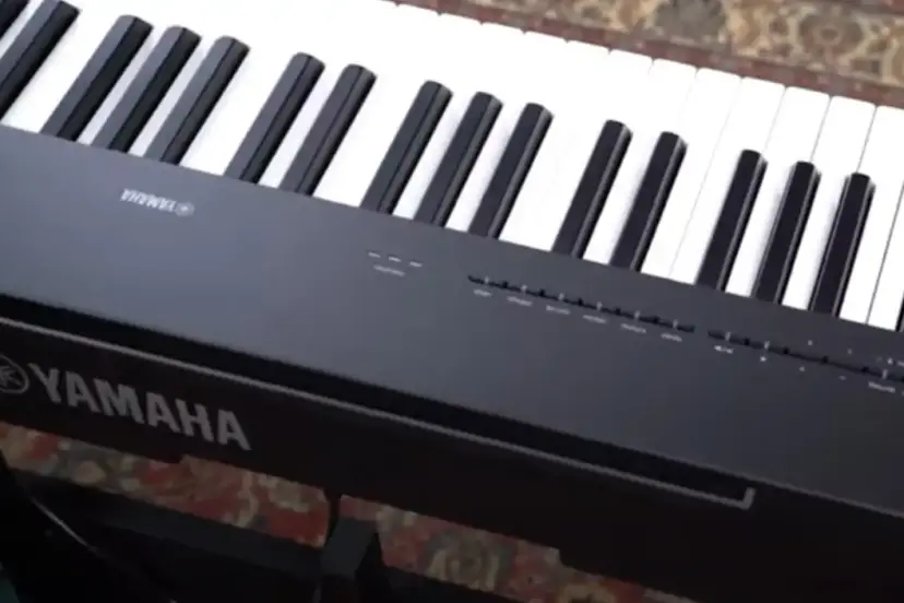 Yamaha P-225 digital piano with 88 weighted keys, sleek design, and built-in speakers, perfect for both home use and live performances