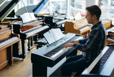 Selection of pianos including acoustic and digital models, showcasing various sizes, designs, and features for beginners and professionals.